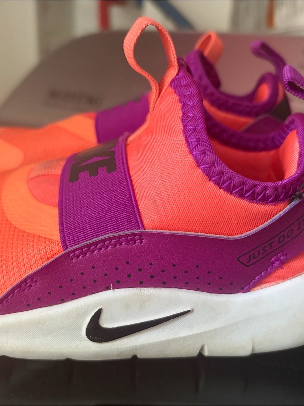 Nike Kids Slip-On Sneakers in Neon Orange and Vibrant Purple